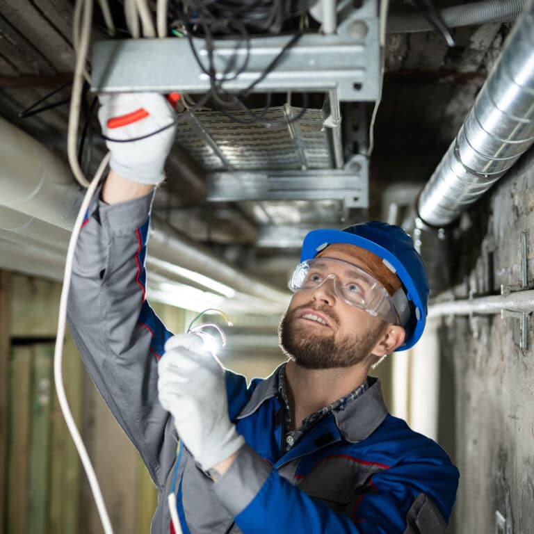 Male Worker Connecting Cables